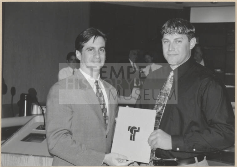 Photograph of Mayor Niel Giuliano presenting an award