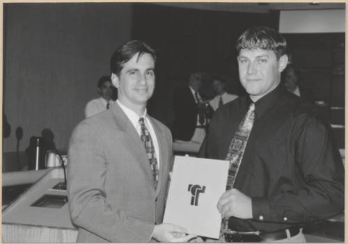 Photograph of Mayor Niel Giuliano presenting an award