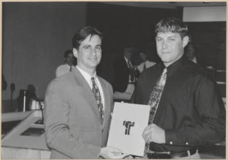 Photograph of Mayor Niel Giuliano presenting an award