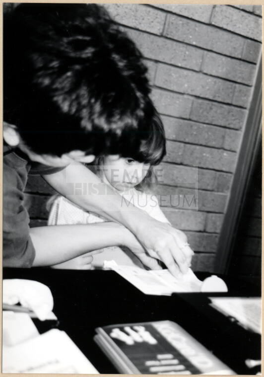 Black and White photograph of finger painting at Fire Prevention Day