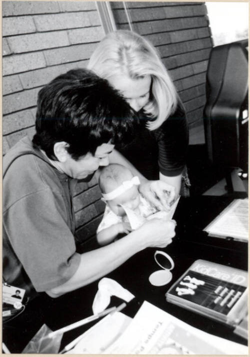 Black and White photograph of baby fingerprinted at Fire Prevention Day