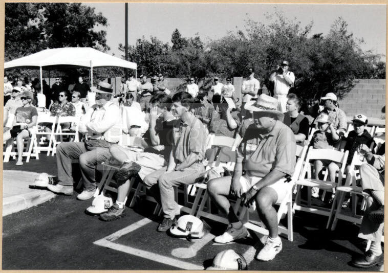 Black and white photograph of audience seated at dedication of Apache Blvd. Fire Station