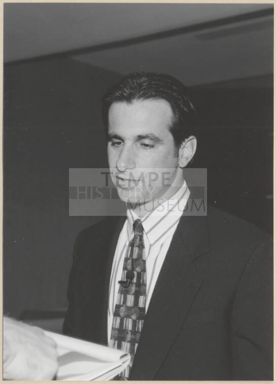 Black and white photograph of Mayor Niel Giuliano at Town Lake contract signing
