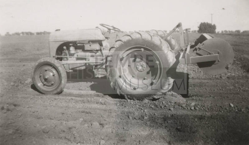 Tractor with Rollover Scraper