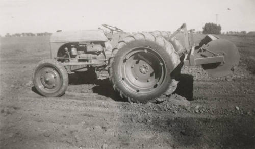 Tractor with Rollover Scraper