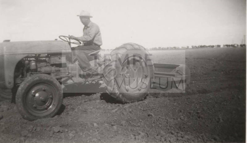 L. Ramsey on Tractor W/ Rollover Scraper