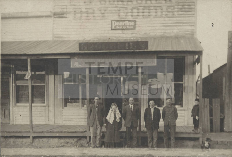 Group Portrait at Grocery Storefront