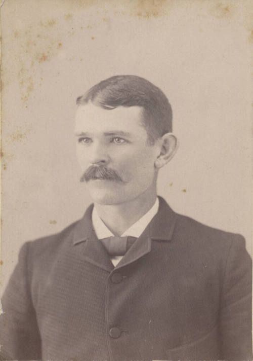 Shoulder, Man, Neck Tie and Dark Jacket