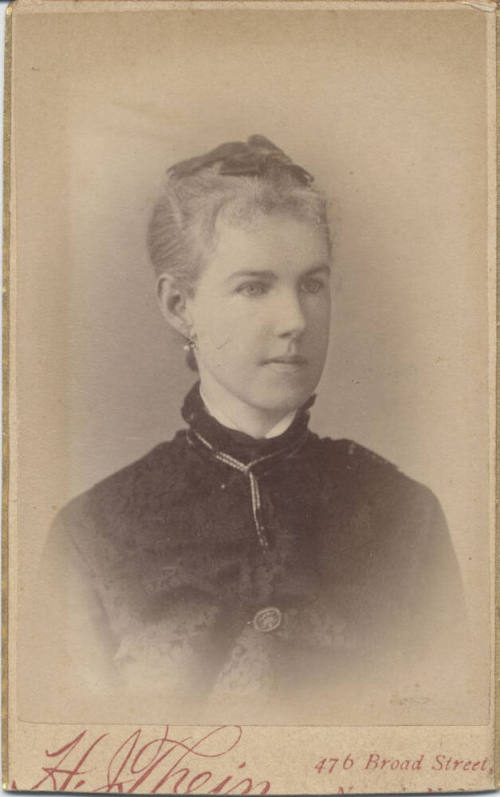 Bust, Woman, Boalo Tie and Dark Top