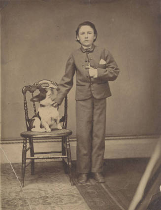 Standing Child with hand on Dog