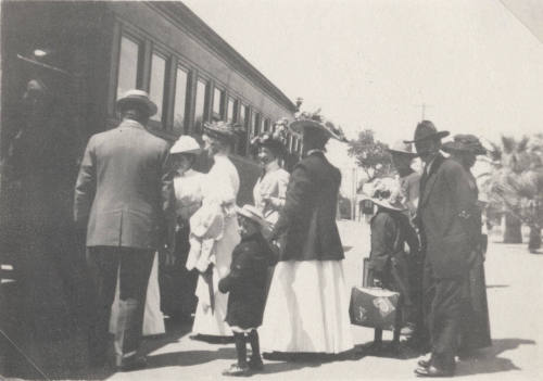Group of People Boarding a Train