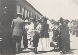 Group of People Boarding a Train