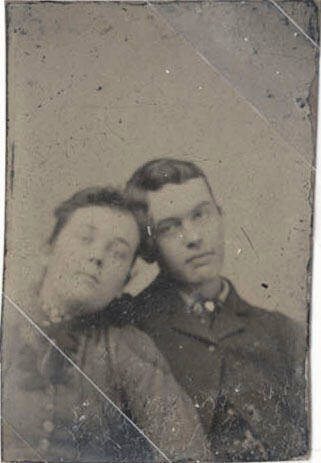 Couple Leaning Their Heads Together
