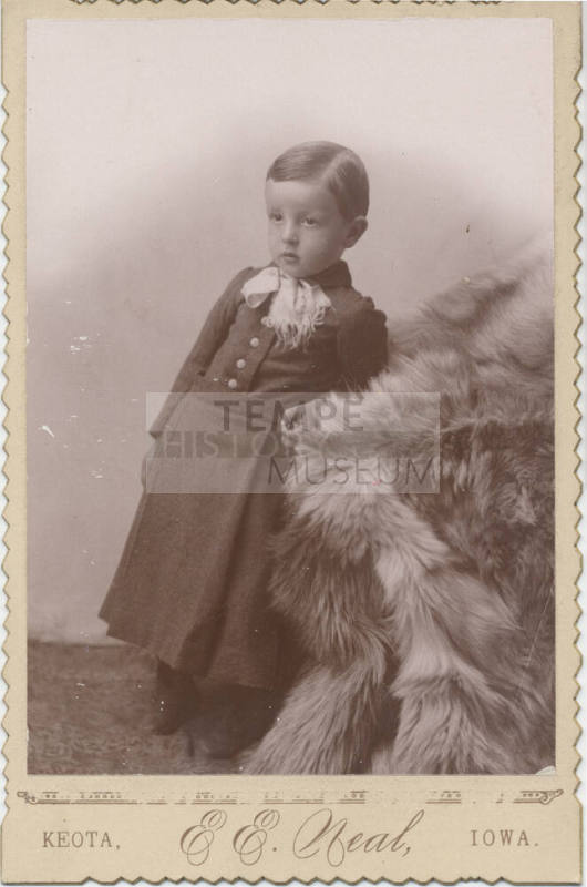 Child Leaning on Fur in School Uniform