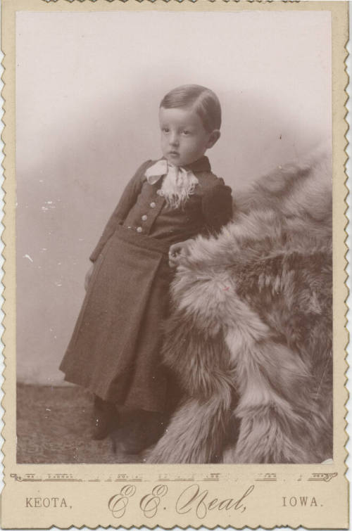 Child Leaning on Fur in School Uniform