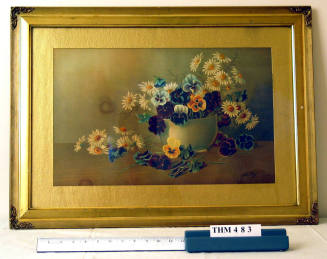 Framed watercolor painting of pansies and daisies