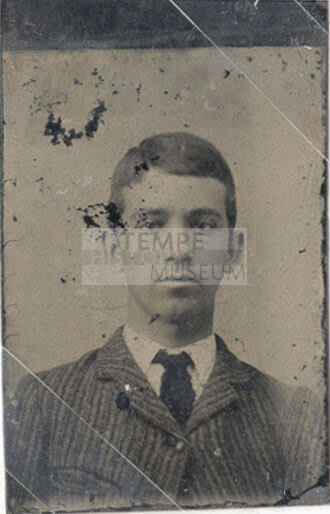 Portrait of Man in Striped Coat