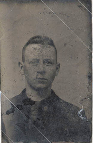 Bust, Man, Dark Suit and Very Short Hair