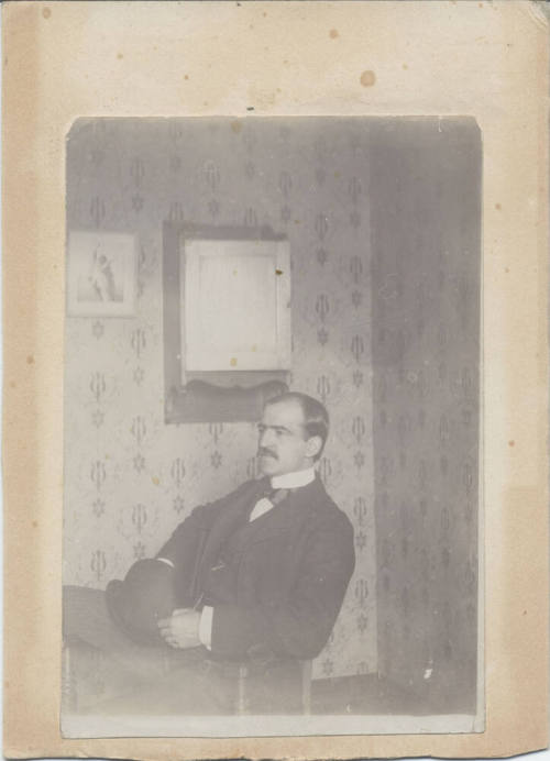 Sitting Man with Hat on His Lap