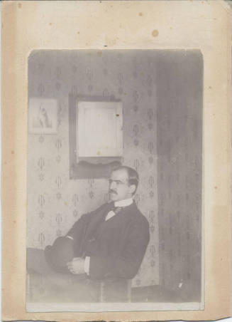 Sitting Man with Hat on His Lap