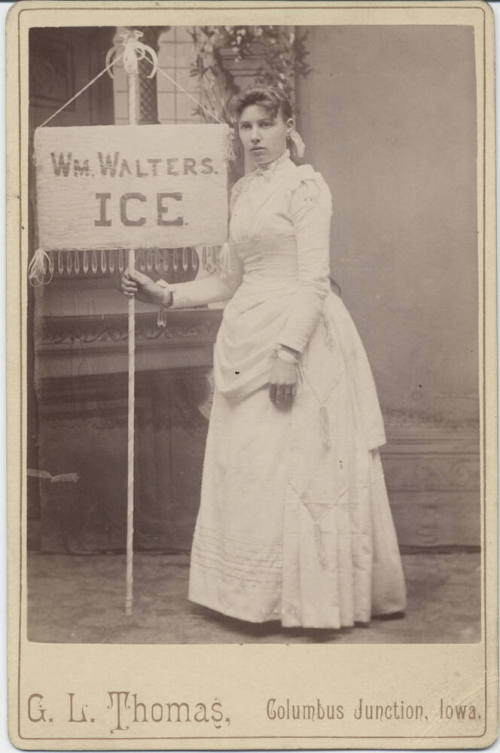 Woman Holding a Wm. Walter's Ice Sign