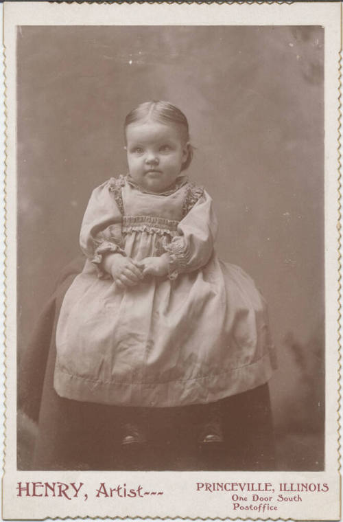 Sitting Child with Plain Clothing On