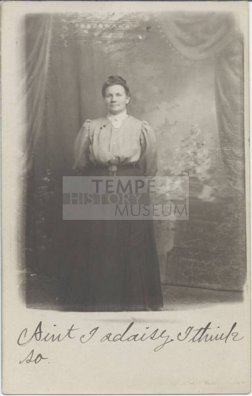Standing Woman in Front of a Wall
