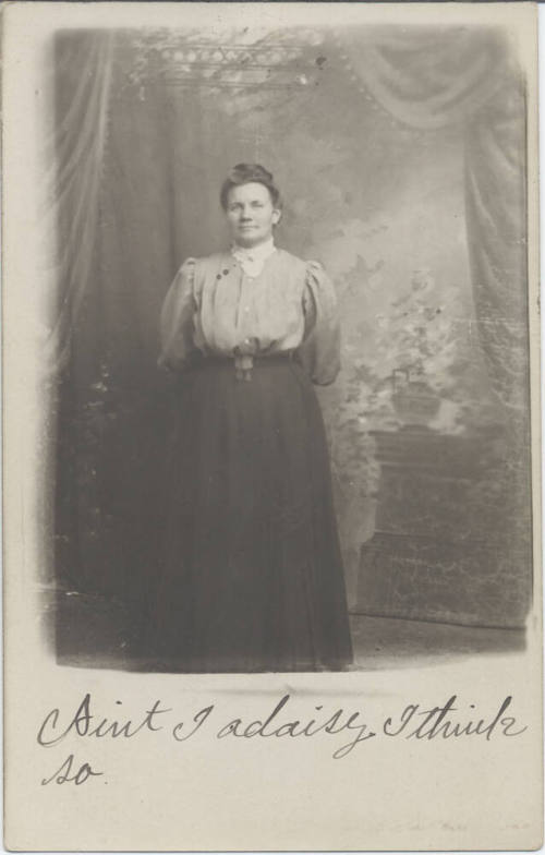 Standing Woman in Front of a Wall