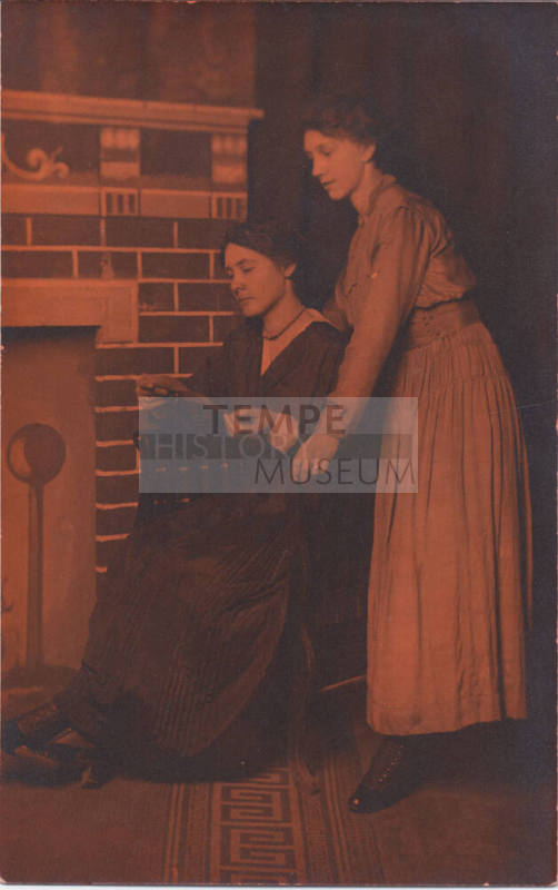Two Women Reading a Letter