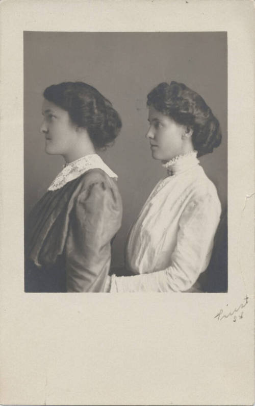 Two Women Standing to the Side