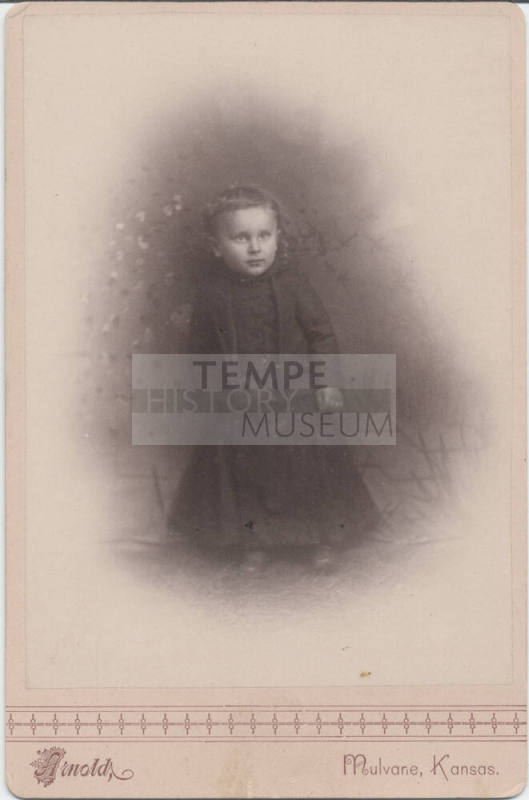 Sitting Child in Dark Clothing