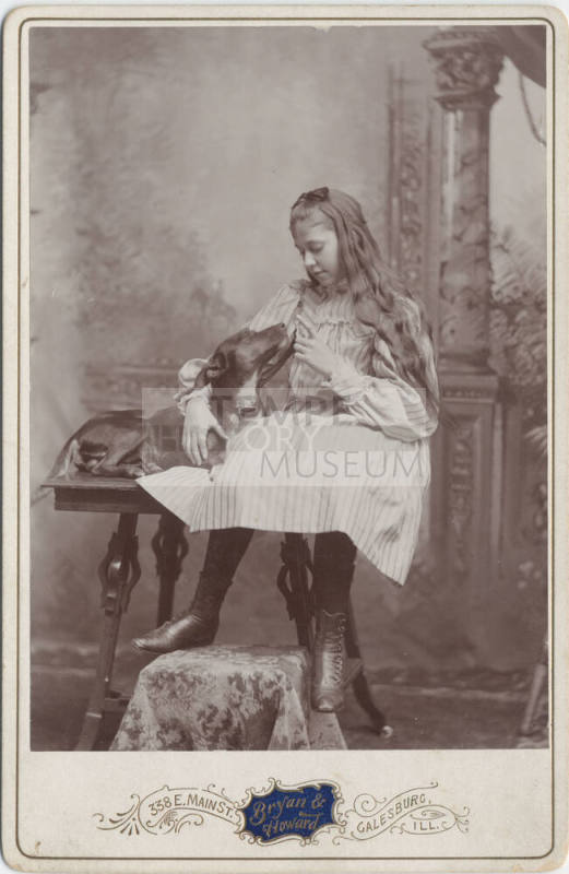 Full Length Portrait of Seated Girl