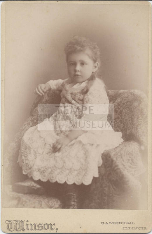Full Length Portrait of Seated Girl