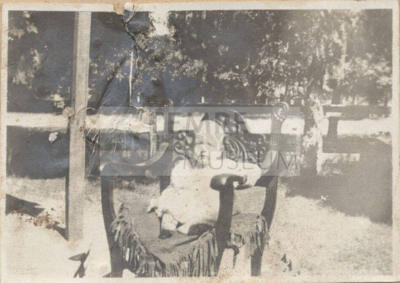 Full Length Picture of Seated Child