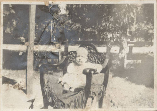 Full Length Picture of Seated Child