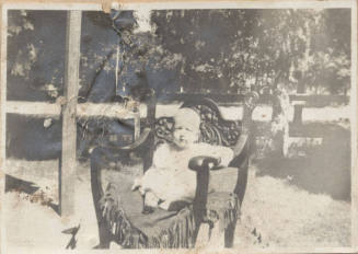 Full Length Picture of Seated Child