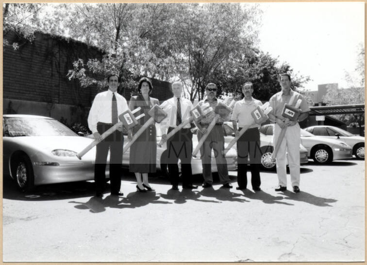 Black and white photograph of Niel Giuliano and other city employees at Tempe's electric Vehicle debut