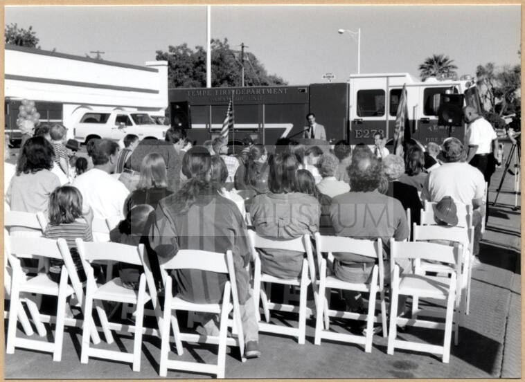 Black and white photograph of Niel Giuliano speaking to a crowd at fire station ground breaking