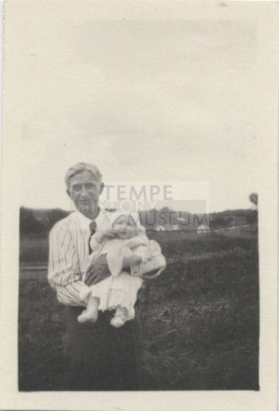 Portrait of Man with Baby