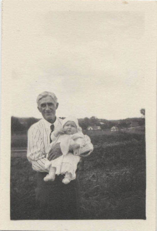 Portrait of Man with Baby