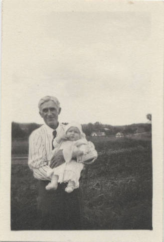 Portrait of Man with Baby