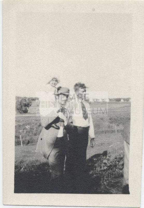 Portrait of Two Men and Baby