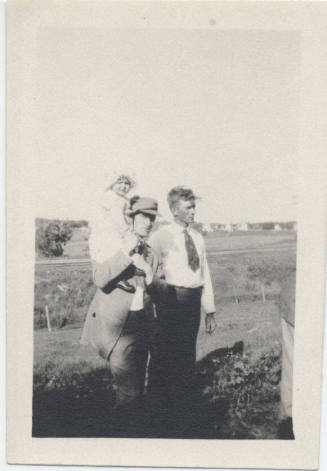 Portrait of Two Men and Baby