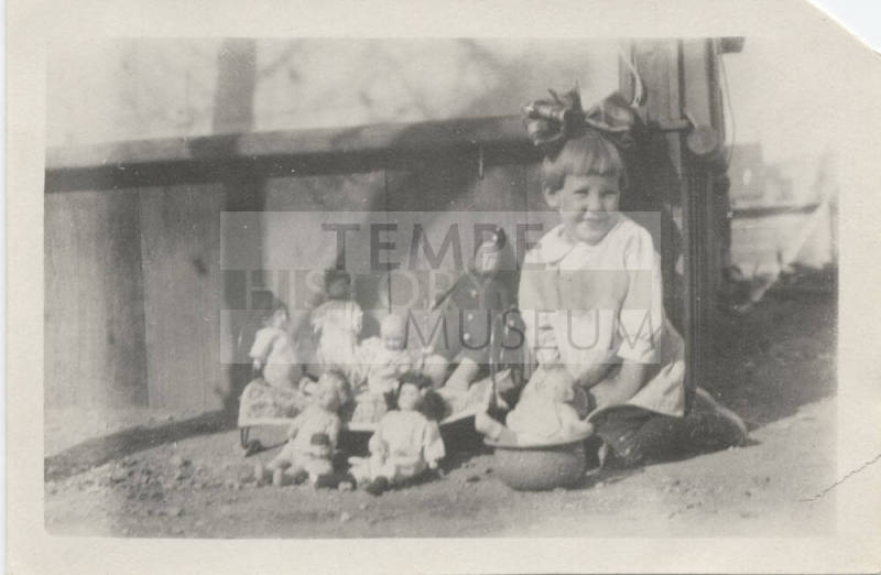 Picture of Girl Outside with Her Dolls