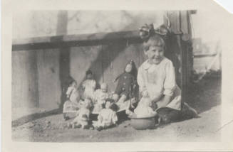 Picture of Girl Outside with Her Dolls