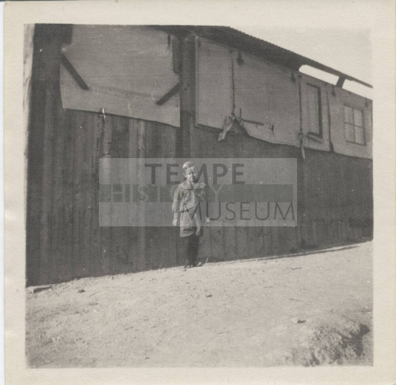 Portrait of Boy in Front of Building
