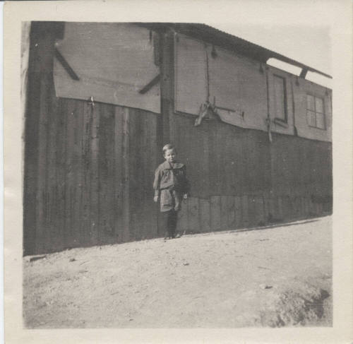 Portrait of Boy in Front of Building