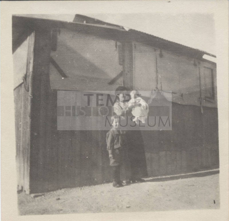 Portrait of Family in Front of Building