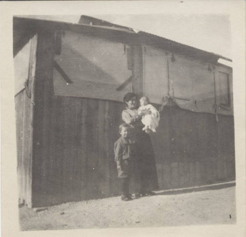 Portrait of Family in Front of Building
