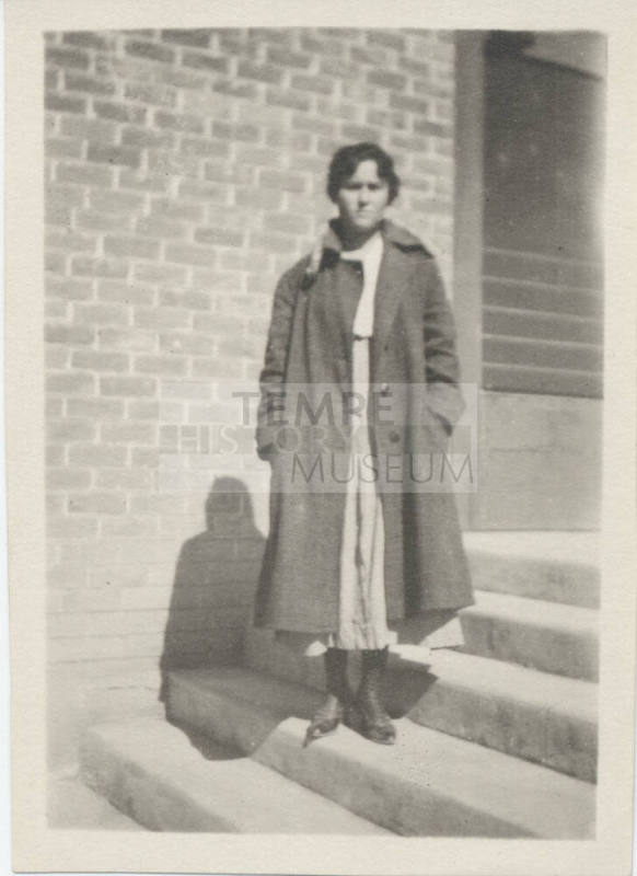 Portrait of Young Woman Outside Building